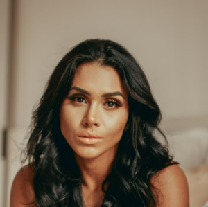 Woman with long black hair indoors