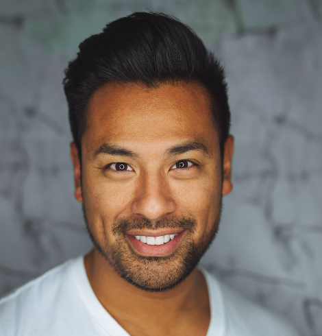 Smiling man with short dark hair